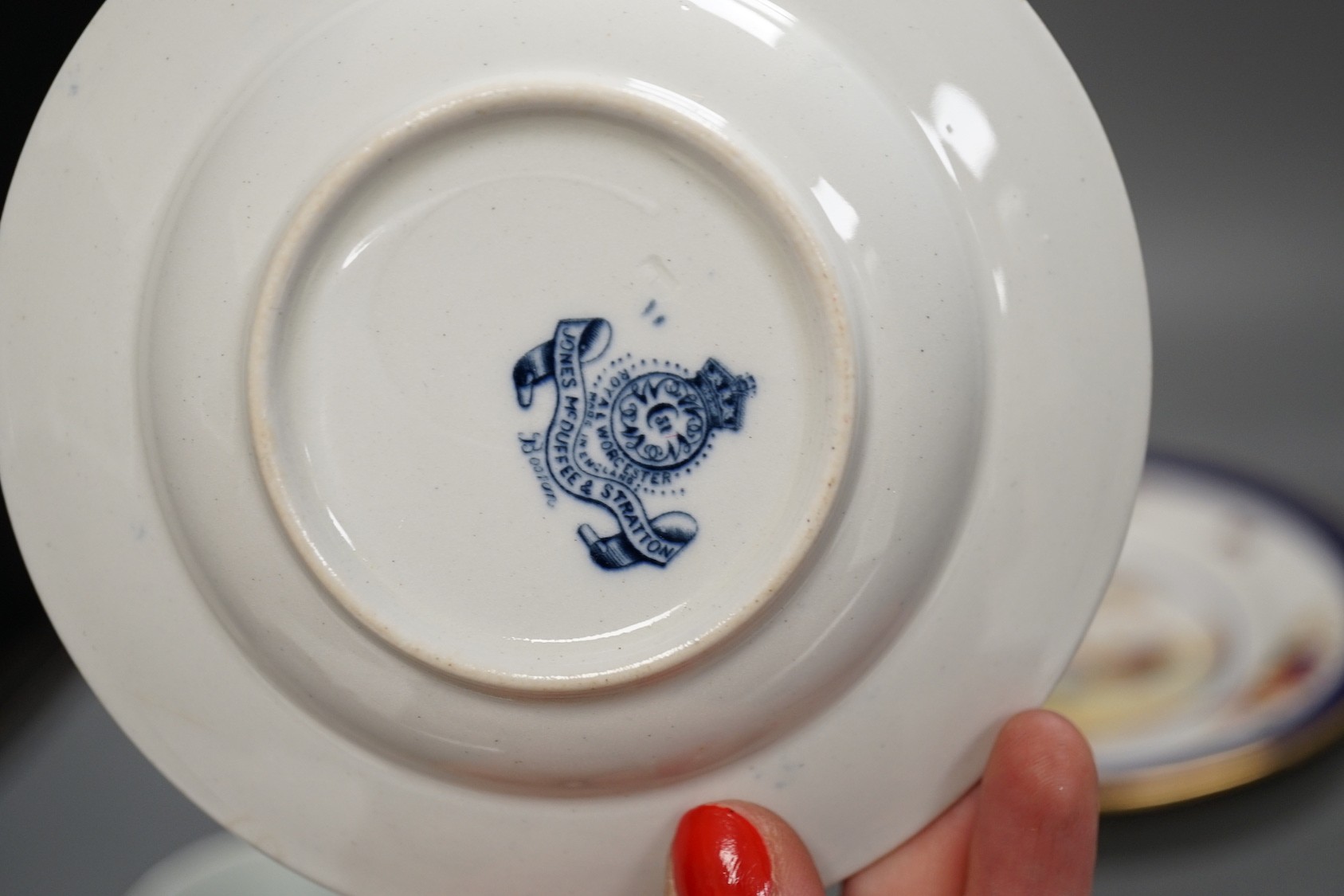 A 19th century enamel on copper trinket box, depicting a shipping fleet, together with a Chamberlain’s Worcester bird plate, a Royal Worcester coffee cup, a Meissen tea cup and three Chinese export cups (9)